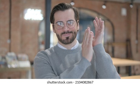 Portrait Of Happy Young Man Clapping, Applauding