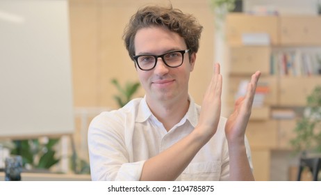 Portrait Of Happy Young Man Clapping, Applauding