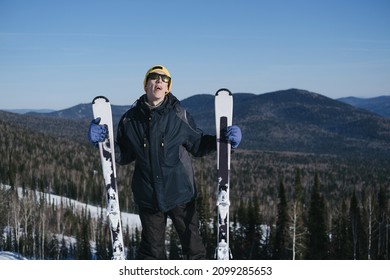 Portrait Of Happy Young Man Living With A Chronic Health Condition, Skiing In Ski Resort. Winter Sport Outdoor