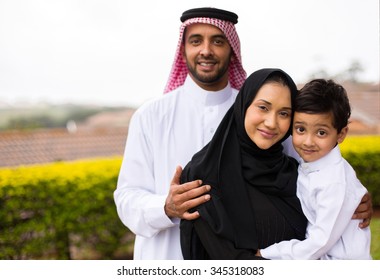 Portrait Of Happy Young Muslim Family Outdoors