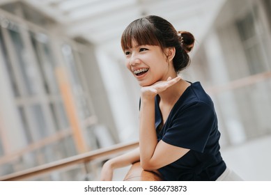 Portrait Of Happy Young Pretty Asian Girl With Braces Smiling.