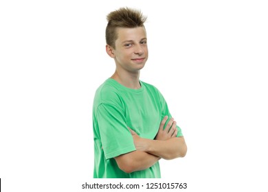 Portrait Of Happy Young Smiling Teenager Boy 14, 15 Years Old With Arms Crossed, White Background Isolated.