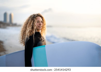 Portrait of happy young woman, girl with surfboard, smiling and enjoying holiday and water sports - Powered by Shutterstock