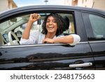 Portrait happy young woman holding car keys