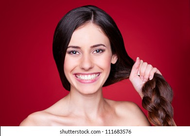 Portrait Of Happy Young Woman With Strong Hair