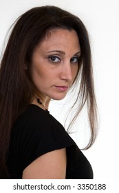 Portrait Headshot Of Hispanic Woman In Her 30s Wearing Black Top