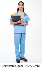 Portrait Of A Health Service Worker, Looking At Camera, Carrying Administrative Documents.