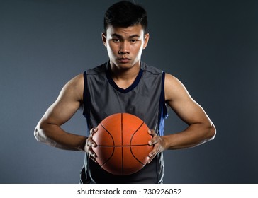 Portrait of a healthy basketball player with a  ball. - Shutterstock ID 730926052