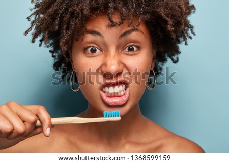 Similar – Image, Stock Photo Black toothpaste and toothbrush over grey