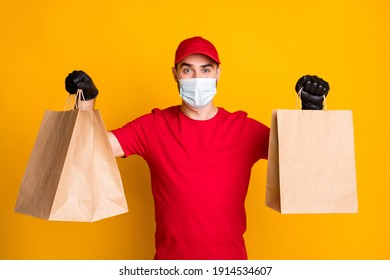 Portrait Of Healthy Guy Wear Gauze Mask Carrying Bringing Cafe Order Takeaway Takeout Isolated On Vivid Yellow Color Background