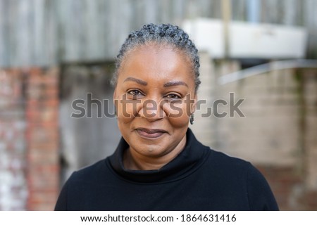 Portrait of a healthy and happy middle-aged African woman living with HIV