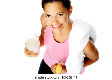 Portrait Of A Healthy Hispanic Woman With Banana Smoothie Protein Shake After Gym Session