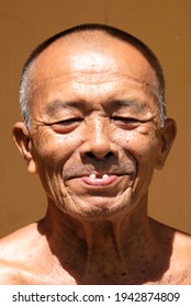 Portrait Of Healthy Indonesian Old Man Sunbathing