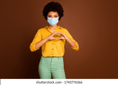 Portrait Of Her She Attractive Dark Skin Wavy-haired Lady Wearing Gauze Mask Showing Healthy Heart Symbol Health Care Healthcare Cardiac Cardiology Medicine Isolated Brown Color Background