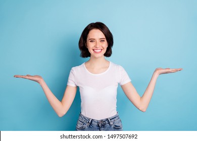 Portrait Of Her She Nice Attractive Lovely Confident Cheerful Cheery Girl Holding Two Invisible Objects On Palms Isolated On Bright Vivid Shine Vibrant Blue Turquoise Color Background