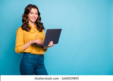 Portrait of her she nice attractive confident cheerful cheery wavy-haired girl holding in hands laptop creating web design isolated on bright vivid shine vibrant green blue turquoise color background