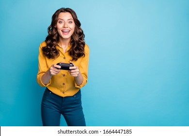 Portrait Of Her She Nice Attractive Lovely Cheerful Cheery Wavy-haired Girl Playing Video Game On Weekend Isolated On Bight Vivid Shine Vibrant Green Blue Turquoise Color Background