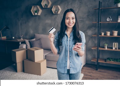 Portrait Of Her She Nice Attractive Lovely Pretty Cheerful Cheery Girl Showing Plastic Card Using Device App Paying Buying Realestate Life Insurance In Modern Loft Industrial House Apartment