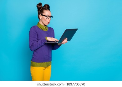 Portrait of her she nice attractive funny childish amazed cheery girl holding in hands laptop working web part-time isolated on bright vivid shine vibrant blue green teal turquoise color background