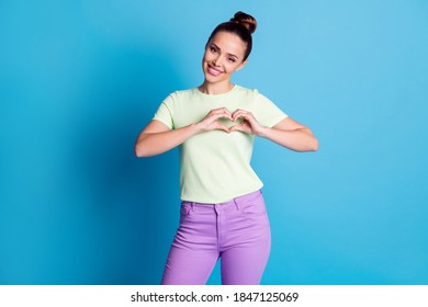 Portrait of her she nice attractive lovely pretty sweet cheerful cheery girl showing heart symbol shape feelings isolated over bright vivid shine vibrant blue color background