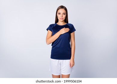 Portrait of her she nice attractive lovely pretty cute serious focused straight-haired girl holding hand on heart swearing praying isolated over light white gray pastel color background - Powered by Shutterstock