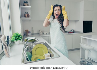 Portrait of her she nice lovely attractive beautiful mad scared frightened fury afraid wavy-haired house-wife screaming near dirty plates pile in modern light white interior indoors