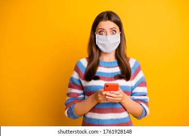 Portrait Of Her She Nice Worried Scared Brown-haired Girl Wearing Mask Using Device Reading Bad Fake News China Wuhan Mers Cov Isolated On Bright Vivid Shine Vibrant Yellow Color Background