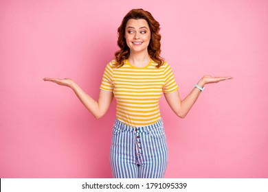 Portrait of her she nice-looking attractive lovely curious cheerful cheery wavy-haired girl holding on two palms advice advert deciding isolated over pink pastel color background