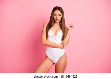 Portrait of her she nice-looking attractive lovely lovable winsome adorable perfect content straight-haired lady posing in one-piece suit isolated over pink pastel background