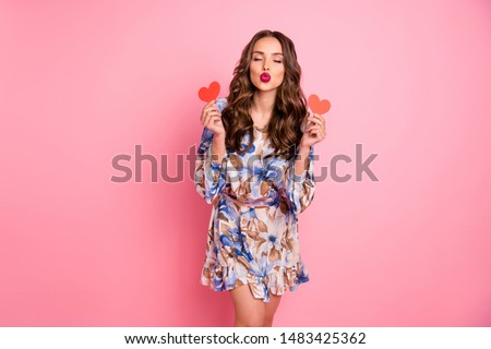 Portrait of her she nice-looking attractive lovely lovable feminine cheerful cheery wavy-haired girl holding in hands two small little heart sending you kiss isolated over pink background
