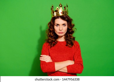 Portrait of her she nice-looking lovely winsome pretty attractive serious bossy selfish wavy-haired girl in red sweater crown feminism isolated on bright vivid shine green background