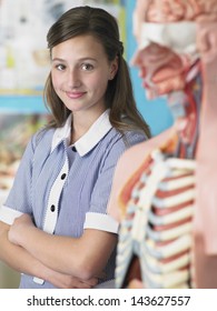 Portrait Of High School Student Standing By Anatomical Model
