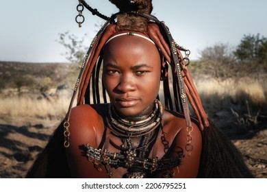 Portrait of a Himba woman dressed in traditional style in Namibia, Africa.