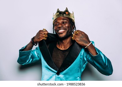 Portrait Of An Hip Hop Music Musician. Cinematic Image Of A Man Wearing Party Clothes And Jewels