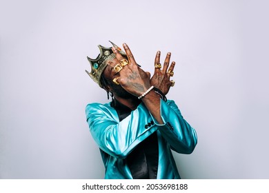 Portrait Of An Hip Hop Music Musician. Cinematic Image Of A Man Wearing Party Clothes And Jewels