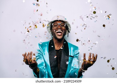 Portrait Of An Hip Hop Music Musician. Cinematic Image Of A Man Under Confetti Drop