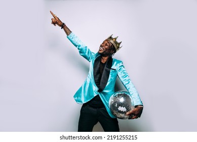 Portrait Of An Hip Hop Music Musician. Cinematic Image Of A Man Wearing Party Clothes And Jewels