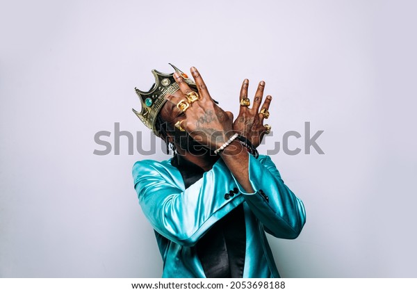 portrait of an hip hop music\
musician. Cinematic image of a man wearing party clothes and\
jewels