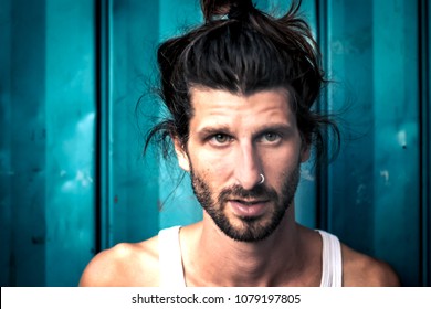 Portrait Of A Hipster Man With Man Bun And Piercing 