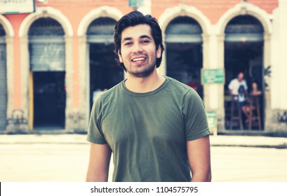 Portrait Of Hipster Man In Shabby Colonial Town In Vintage Retro Look