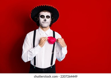 Portrait Of His He Handsome Scary Content Cheery Imposing Guy Gentleman Wearing Sombrero Adjusting Festal Accessory Santa Muerte Cult Ritual Isolated Bright Vivid Shine Vibrant Red Color Background