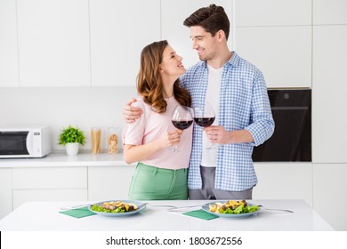 Portrait of his he her she two nice cheerful cheery affectionate people spending romance day eating tasty food domestic restaurant drinking red wine in light white interior kitchen house apartment - Powered by Shutterstock