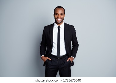 Portrait Of His He Nice Attractive Cheerful Cheery Guy Employee Banker Financier Wearing Fashionable Brandy Suit Holding Hands In Pockets Posing Isolated Over Grey Pastel Color Background