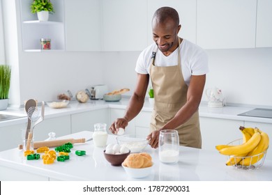 Portrait of his he nice attractive cheerful cheery guy confectioner making fresh bread egg pie hachapuri national culinary confectionery in modern light white interior house kitchen - Powered by Shutterstock