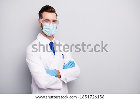 Portrait of his he nice attractive content skilled qualified experienced doc paramedic scientist dentist surgeon physicist folded arms isolated on light white gray pastel color background