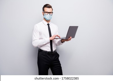 Portrait Of His He Nice Skilled Guy Employer Using Laptop Wearing Safety Gauze Mask Searching Infro Market Research Mer Cov Contamination Prevention Isolated Grey Color Background