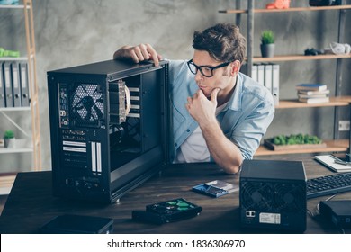 Portrait Of His He Serious Nice Attractive Focused Guy Geek Skilled Expert Technician Guarantee Service Testing Repairing Hardware At Modern Loft Industrial Home Office Workplace Workstation