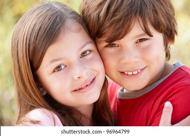 Portrait Hispanic Brother And Sister Outdoors