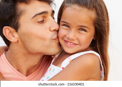 Portrait Of Hispanic Father And Daughter