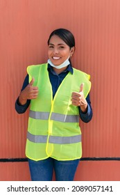 Portrait Of A Hispanic Female Construction Worker Wearing A Protective Mask